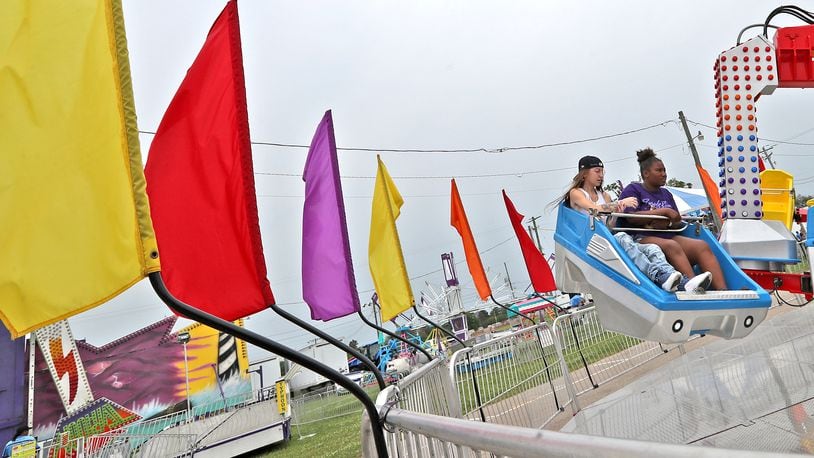 Jai Dean, left, and Montasia Suttles ride the Xtreme ride at the Clark County Fair Friday. BILL LACKEY/STAFF