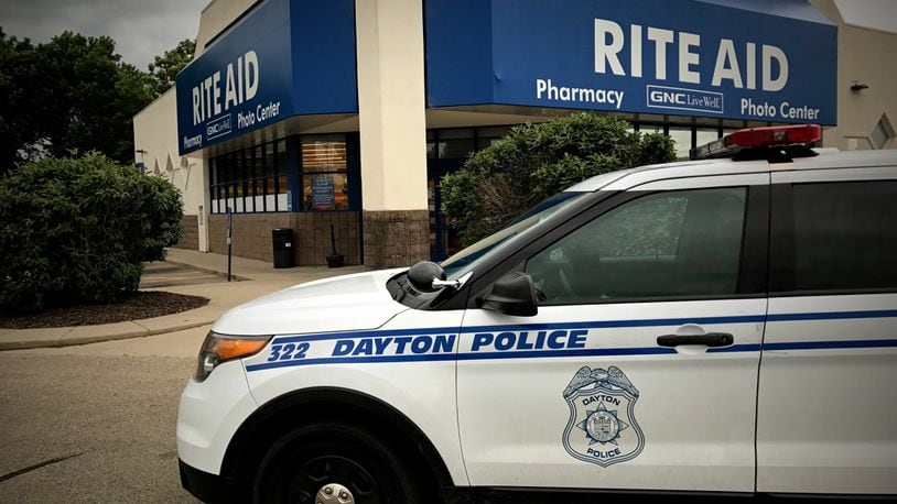 Dayton police responded to a robbery June 7, 2017, at Rite Aid on Linden Avenue. JIM NOELKER / STAFF