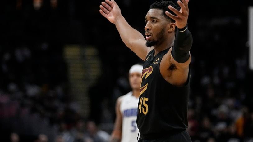 Cleveland Cavaliers guard Donovan Mitchell gestures to the crowd in the second half of Game 7 of an NBA basketball first-round playoff series against the Orlando Magic, Sunday, May 5, 2024, in Cleveland. (AP Photo/Sue Ogrocki)
