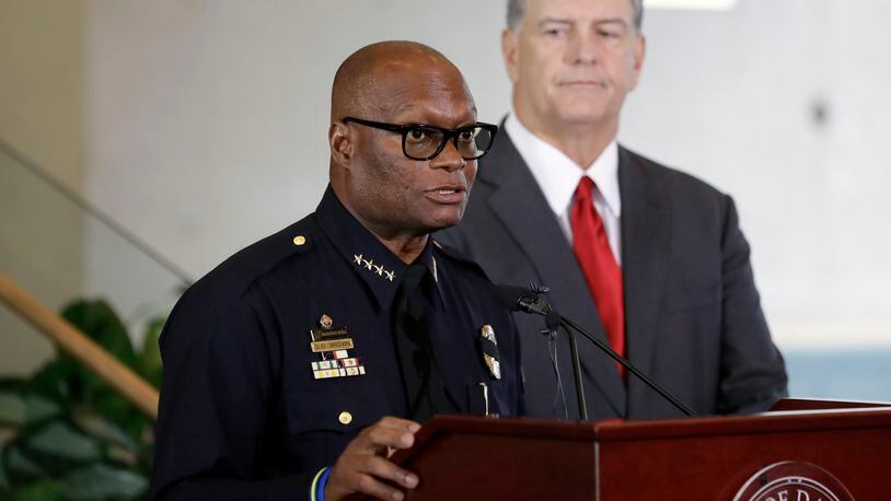 Dallas police chief David Brown, left, and mayor Mike Rawlings, right, during a news conference, Friday, July 8, 2016, in Dallas. Five police officers are dead and several injured following a shooting in downtown Dallas Thursday night. (AP Photo/Eric Gay)