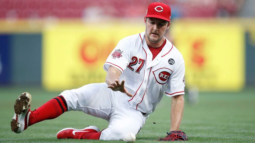 CINCINNATI, OH - AUGUST 19: Trevor Bauer #27 of the Cincinnati Reds tries to field the ball near the third-base line in the second inning against the San Diego Padres at Great American Ball Park on August 19, 2019 in Cincinnati, Ohio. (Photo by Joe Robbins/Getty Images)
