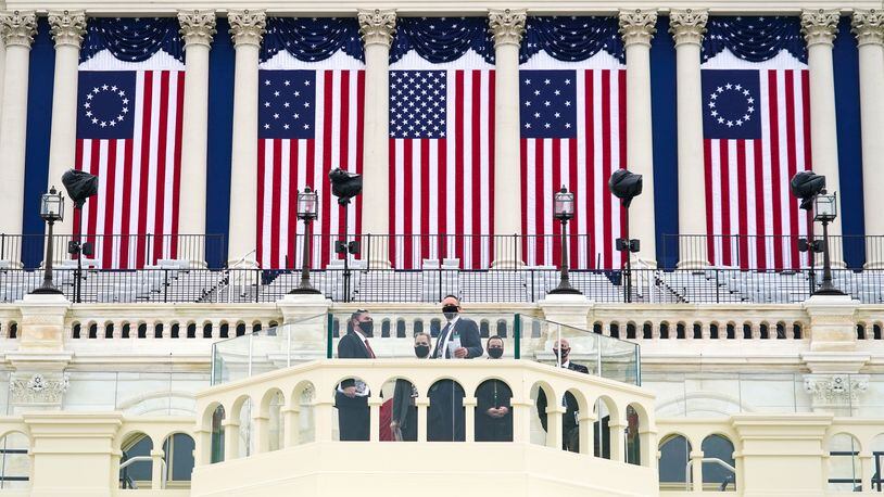 U.S. Secret Service officers check the inauguration stage at the U.S. Capitol in Washington on Friday, Jan. 15, 2021. Law enforcement officials are bracing for more unrest in the days leading up to the inauguration.