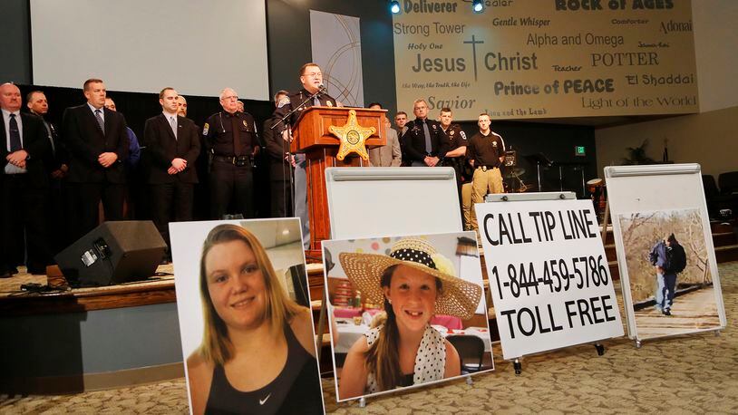 Capt. David Bursten of the Indiana State Police is joined by law enforcement officials from numerous departments to provide the latest details of the investigation into the murders of Liberty German and Abigail Williams on Wednesday, Feb. 22, 2017, at Delphi United Methodist Church in Delphi, Ind. German, 14, Williams, 13, were murdered last week while hiking the High Bridge Trail just east of Delphi. Police released an audio clip believed to be that of the girl's killer taken from Liberty German's cellphone. (John Terhune/Journal & Courier via AP)