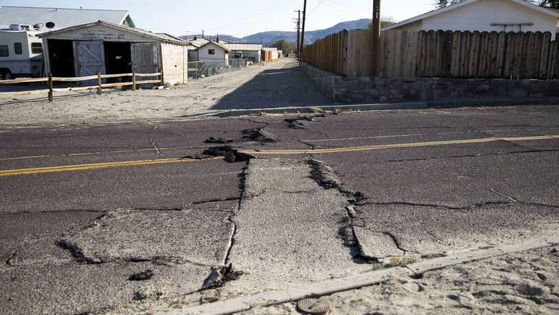A cracked road following an earthquake in Trona, Calif., on Saturday, July 6, 2019. A 7.1-magnitude earthquake rattled Southern California on Friday night, one day after the strongest recorded quake there in 20 years struck - and seismologists warned that further episodes are expected. (Jenna Schoenefeld/The New York Times)