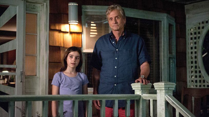 Sarah (Sterling Jerins) and Oren (Michael Douglas) await the return of someone special in “And So It Goes.” (Clay Enos/Clarius Entertainment/MCT)