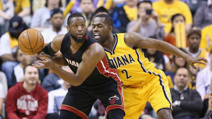 INDIANAPOLIS, IN - APRIL 05: Rodney Stuckey #2 of the Indiana Pacers guards Dwayne Wade #3 of the Miami Heat at Bankers Life Fieldhouse on April 5, 2015 in Indianapolis, Indiana. (Photo by Andy Lyons/Getty Images)