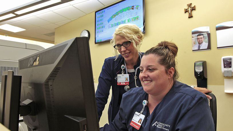 Nurses Holly Ogletree, left, and Rachelle Bowen look at a patients information of the My Chart program on the computer Friday Springfield Regional Medical Center. The hospital was recently recognized for its use of technology. Bill Lackey/Staff