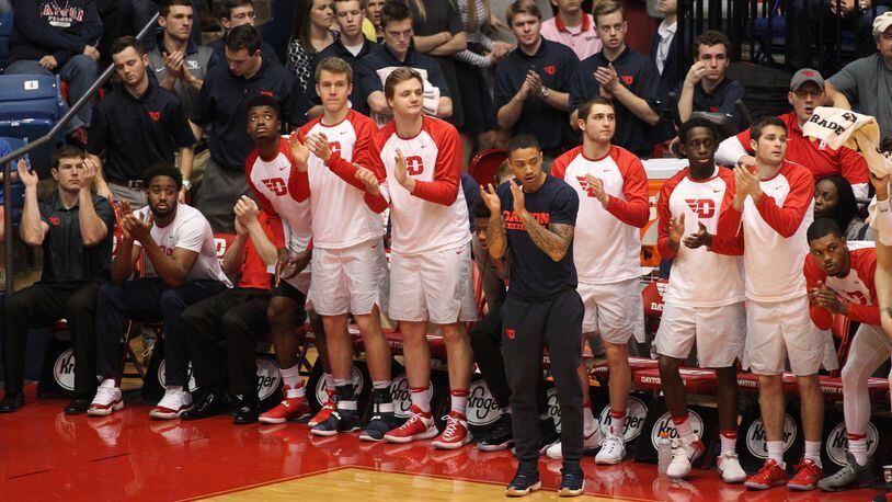 Dayton players, including Josh Cunningham, far left, cheer during a game against Saint Louis on Jan. 22, 2017, at UD Arena.