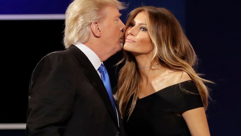 Republican presidential nominee Donald Trump kisses his wife Melania Trump, wife of Donald Trump after the presidential debate with Democratic presidential nominee Hillary Clinton at Hofstra University in Hempstead, N.Y., Monday, Sept. 26, 2016. (AP Photo/David Goldman)