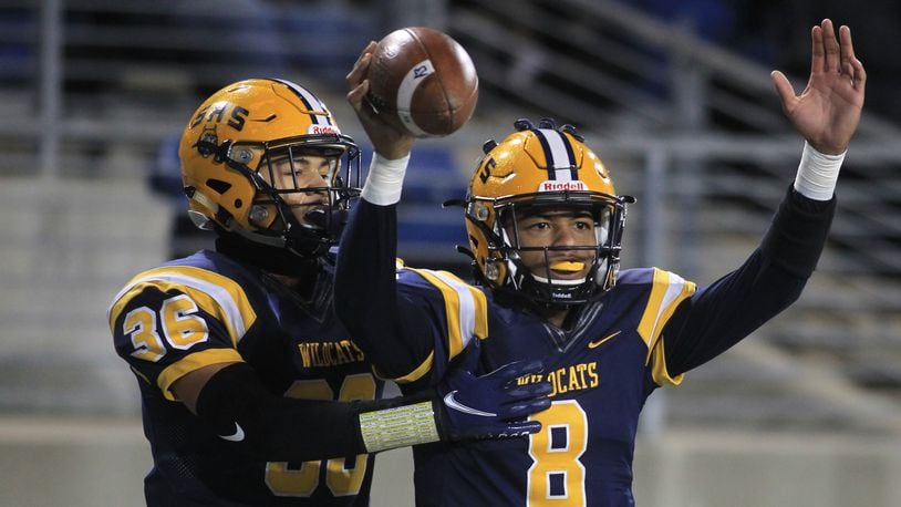 Springfield's Te'Sean Smoot, right, and Delian Bradley celebrate a touchdown in the first half against St. Edward in the Division I state championship game on Friday, Dec. 3, 2021, at Tom Benson Hall of Fame Stadium in Canton. Smoot (quarterback) and Bradley (safety) were named first-team, All-Ohio on Thursday. Smoot also was named the co-offensive player of the year in Division I. David Jablonski/Staff