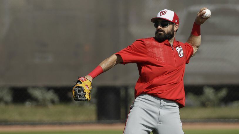 Washington Nationals center fielder Adam Eaton throws during a spring training baseball workout Sunday, Feb. 19, 2017, in West Palm Beach, Fla. Eaton, who is expected to start in center field and bat first or second in the lineup, began showing the Nationals what he can do during Sunday’s first official full-squad workout of spring training. (AP Photo/David J. Phillip)