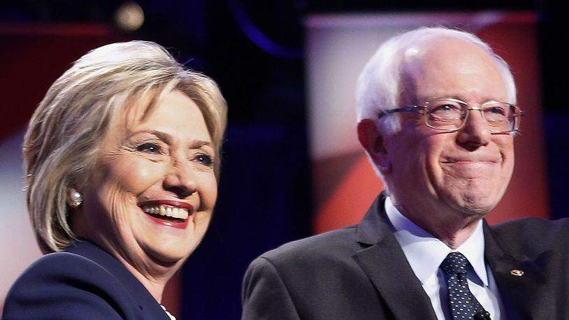 Democratic presidential candidates Hillary Clinton, left, and Sen. Bernie Sanders, I-Vt. (AP Photo/Jim Cole)