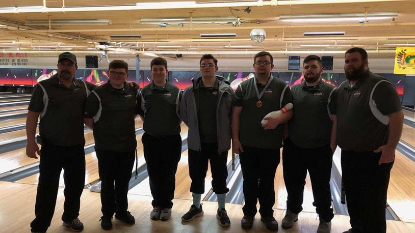 The Urbana bowling team recently rolled a pair of 300 games — one as a team and one from Justin Brown — during matches they dedicated to honor Gary Oakes Sr., the coach’s father, and Troy Byrd, an 11-year old who died while playing basketball. From left to right: Coach Jason Brown, Andru Troyer, Kolin Bowdle, Austin Fisher, Justin Brown, Wyatt Young and coach Richard Oakes (missing are Jacob Coffey, Nate Wright and Austin Anderson).
