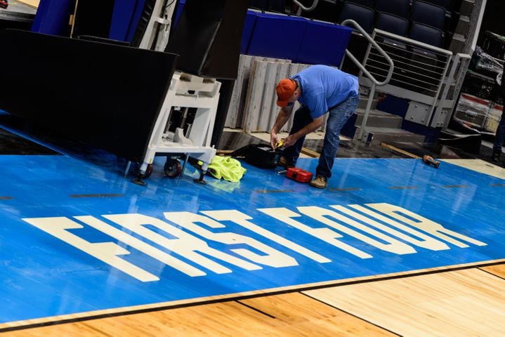 PHOTOS: NCAA First Four basketball court installation at UD Arena