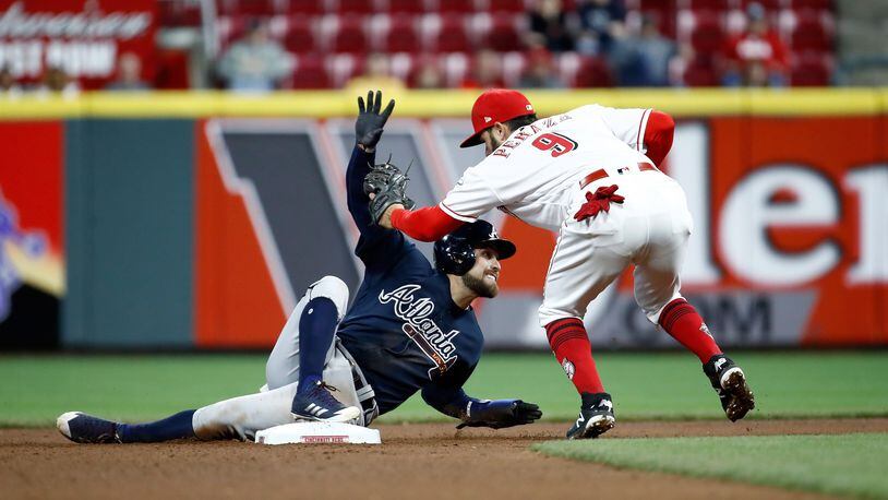 CINCINNATI, OH - APRIL 25: Ender Iciarte #11 of the Atlanta Braves slides safely in to second base ahead of the tag by Jose Peraza #9 of the Cincinnati Reds for a stolen base in the 7th inning at Great American Ball Park on April 25, 2018 in Cincinnati, Ohio. (Photo by Andy Lyons/Getty Images)