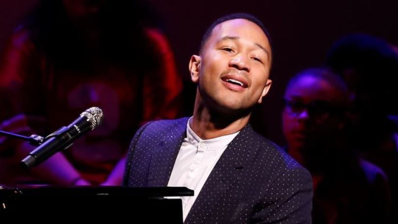 John Legend performs on stage during a concert following the ribbon cutting for the new John Legend Theater in Springfield. Bill Lackey/Staff
