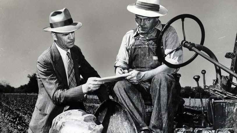 A Census enumerator assists a farmer during the 1950 Census. Photo courtesy of National Archives Catalog
