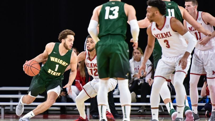 Wright State’s Justin Mitchell dribbles the ball during their game Tuesday, Nov. 14 at Millett Hall on the Miami University Campus in Oxford. The Miami University Redhawks basketball team defeated the Wright State Raiders 73-67 in overtime. NICK GRAHAM/STAFF