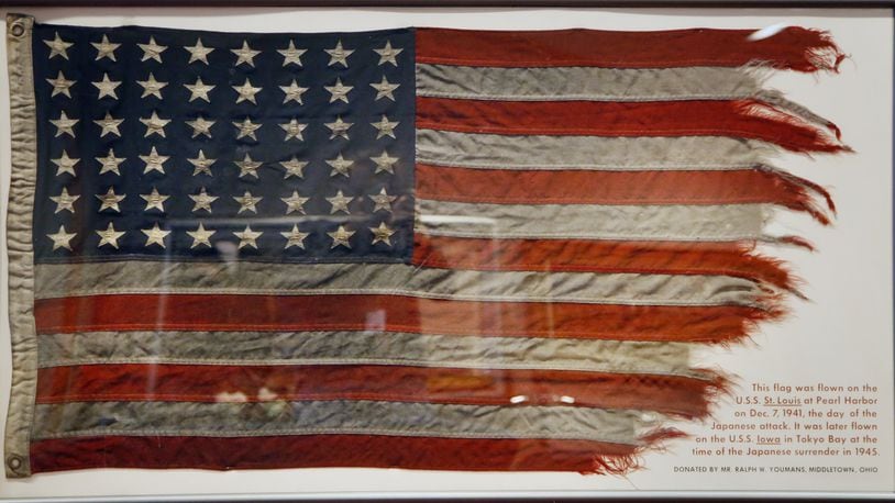 This flag flew on the USS St. Lous in Hawaii during the attack on Pearl Harbor on Dec. 7, 1941. The same flag then flew on the USS Iowa in Tokyo Bay during the Japanese Surrender in 1945. The flag was donated to the National Museum of the U.S. Air Force by Middletown resident Ralph W. Youmans. TY GREENLEES / STAFF