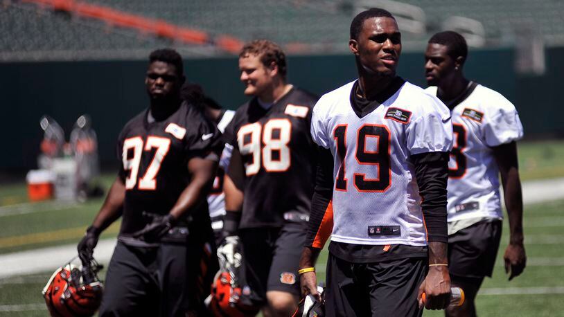 Cincinnati Bengals wide receiver Auden Tate (19) walks off the field following the conclusion of minicamp Thursday at Paul Brown Stadium. JAY MORRISON/STAFF