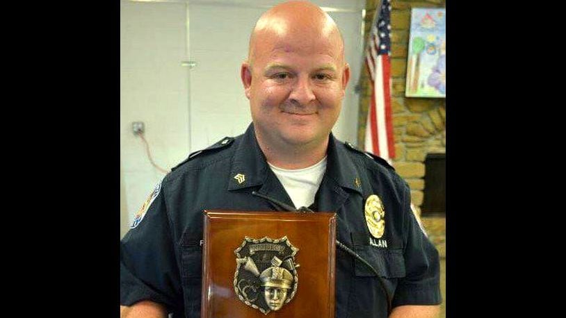 Southport, Indiana, police Lt. Aaron Allan is pictured after winning the small city's inaugural Officer of the Year Award in 2015. Allan was shot 14 times and killed Thursday, July 27, 2017, just hours after walking his 5-year-old son to catch the bus for his first day of kindergarten.