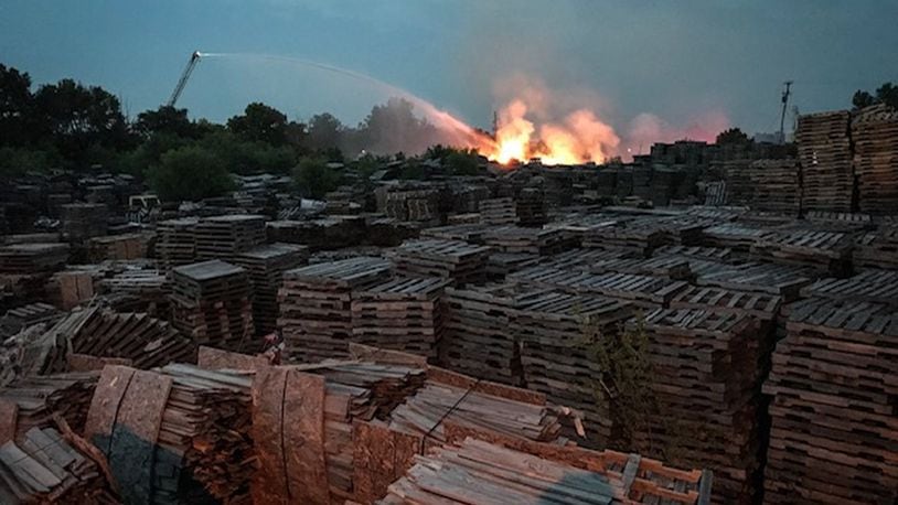 A large fire burned around an acre of pallets on July 10 at a pallet yard on Warder Street in Springfield. STAFF