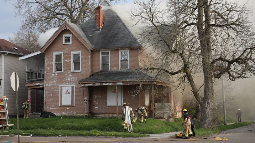 Springfield Fire Division crews responded to a fire at a two-story duplex April 20, 2021, in the 700 block of West Mulberry Street in Springfield. BILL LACKEY/STAFF