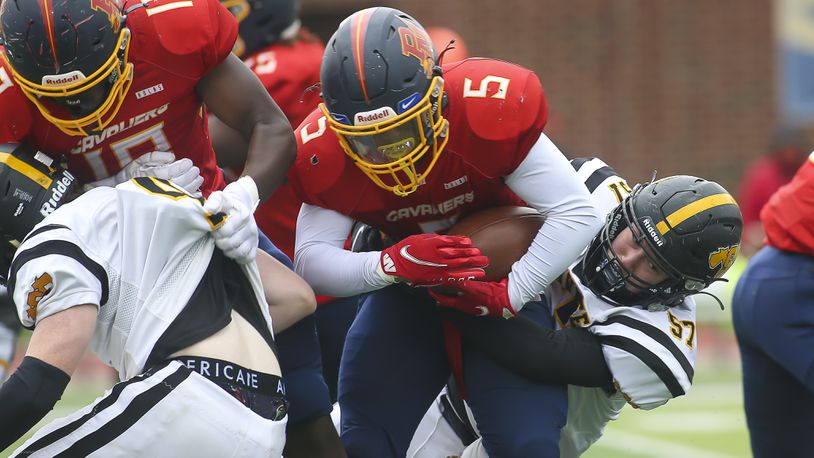 Shawnee High School junior Braden Greene tackle's Purcell Marian's Jesse Jenkins during their game on Saturday, Oct. 30 at Walnut Hills High School in Cincinnati. CONTRIBUTED PHOTO BY MICHAEL COOPER