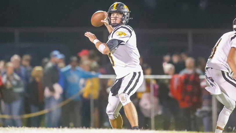 Shawnee High School senior quarterback R.J. Griffin drops back to during their game on Friday night at Richard L. Phillips Field in Springfield. The Braves won 17-7. CONTRIBUTED PHOTO BY MICHAEL COOPER