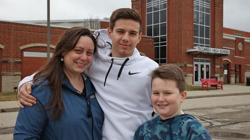 Rachel Suther, with her sons, Nathan Arnold, 18, and Darren Suther, 11. Both are attending school in the Tecumseh Local School District. BILL LACKEY/STAFF