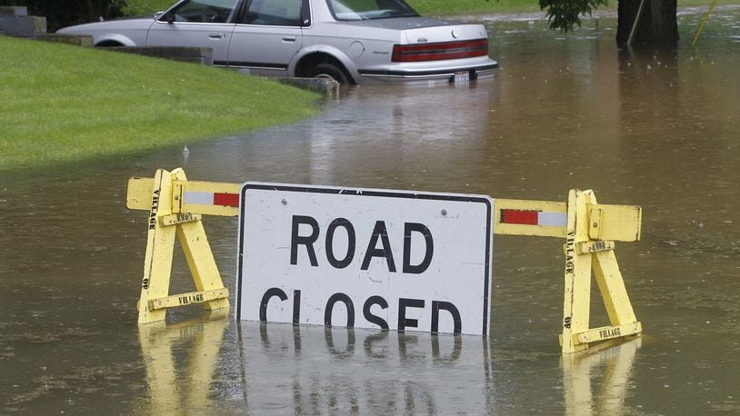 Grand Valley Drive in Enon was closed earlier this month due to flooding. Bill Lackey/Staff