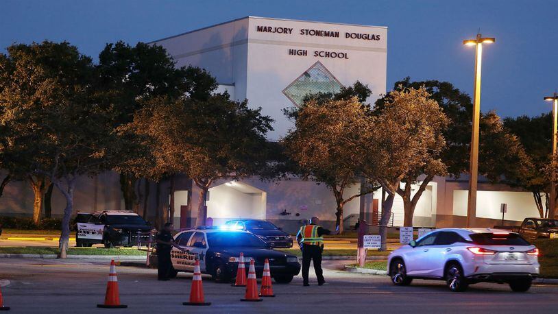 Police keep the campus secure as students arrive at Marjory Stoneman Douglas High School on the first day of school on August 15, 2018 in Parkland, Florida. Former student Nikolas Cruz, 19, is accused of killing 17 students and faculty members at the school on February 14, 2018 during the last school year.