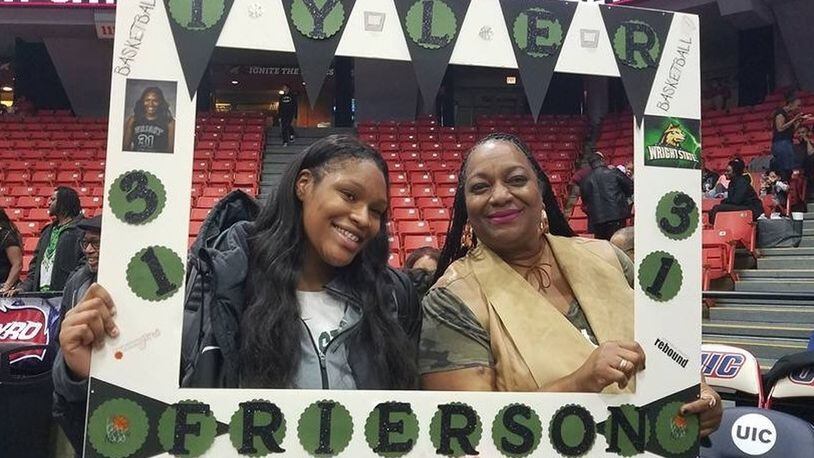 Wright State women’s basketball player Tyler Frierson and her mom, Andrea (right) at a late December game at UIC this season. CONTRIBUTED