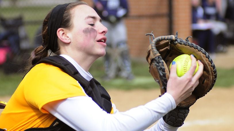 Kenton Ridge's catcher Kenzie Tyson (1) make the out on an infield popup fly ball during girls softball between the Fairmont Firebirds and Kenton Ridge Cougars held Saturday, April 6, 2013 at Kettering Fairmont High School Photo by Charles Caperton