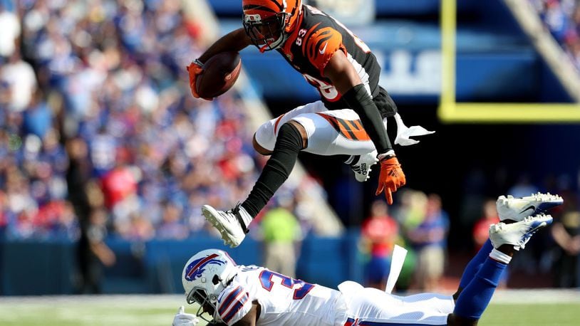 ORCHARD PARK, NEW YORK - SEPTEMBER 22: Tyler Boyd #83 of the Cincinnati Bengals leaps over Siran Neal #33 of the Buffalo Bills during a game at New Era Field on September 22, 2019 in Orchard Park, New York. (Photo by Bryan M. Bennett/Getty Images)