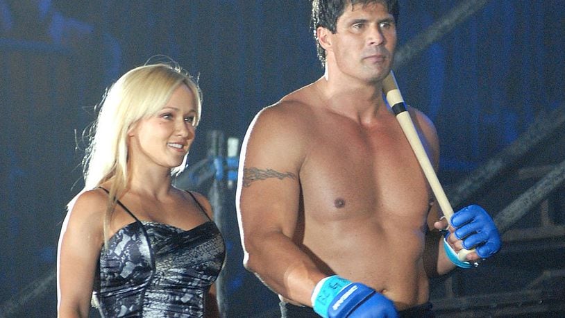 YOKOHAMA, JAPAN - MAY 26: Former Oakland Athletics slugger Jose Canseco (R) and Heidi Northcott walk to the ring with holding a bat prior to the match with Choi Hong-man at first Round of Super Hulk Tournament during Dream.9 at Yokohama Arena on May 26, 2009 in Yokohama, Kanagawa, Japan. Canseco lost at 1 minute 17 seconds in the first round. (Photo by Hiroki Watanabe/Getty Images)