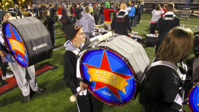Members of the Lakota West Marching Firebirds rehearse Thursday at the school. The nearly 300-member group will perform in the 87th annual Macy’s Thanksgiving Day Parade.