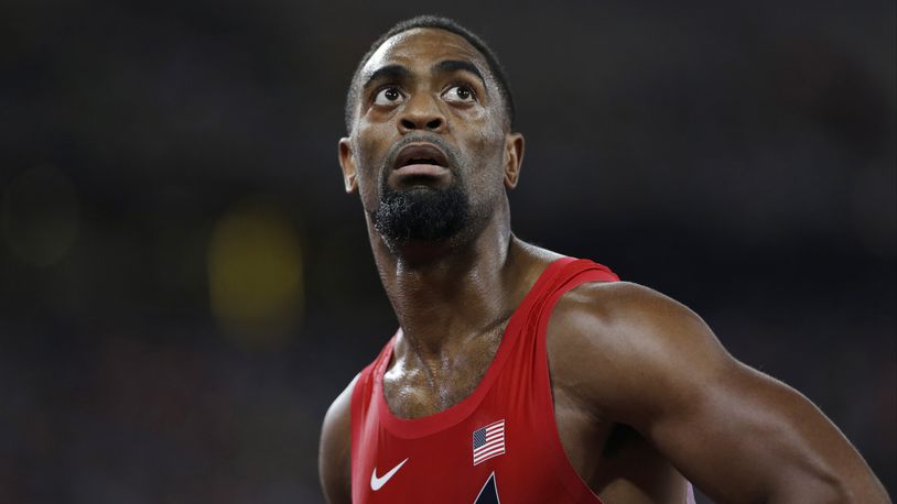 In this Aug. 23, 2015, file photo, United States' Tyson Gay looks at his time from a men's 100-meter semifinal at the World Athletics Championships at the Bird's Nest stadium in Beijing. T