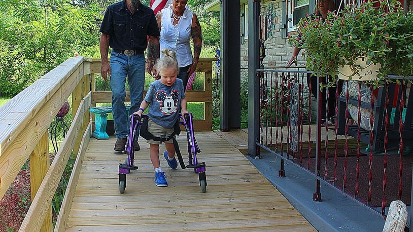 Donovan Puhala enjoys his new ramp while his grandparents Richard and Lori Robinson keep an watchful eye. JEFF GUERINI/STAFF