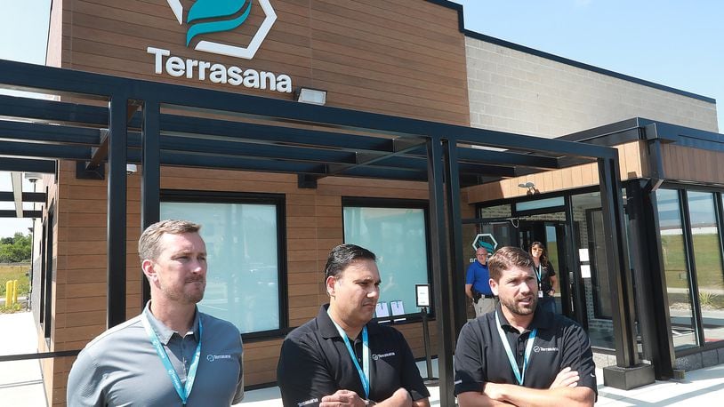 The owners of Terrasana, the new medical marijuana dispenary at 183 Raydo Circle in Springfield, talk about the opening day on Thursday. The owners are, from left, Craig Mauer, Bill Kedia and Todd Yaross. BILL LACKEY/STAFF