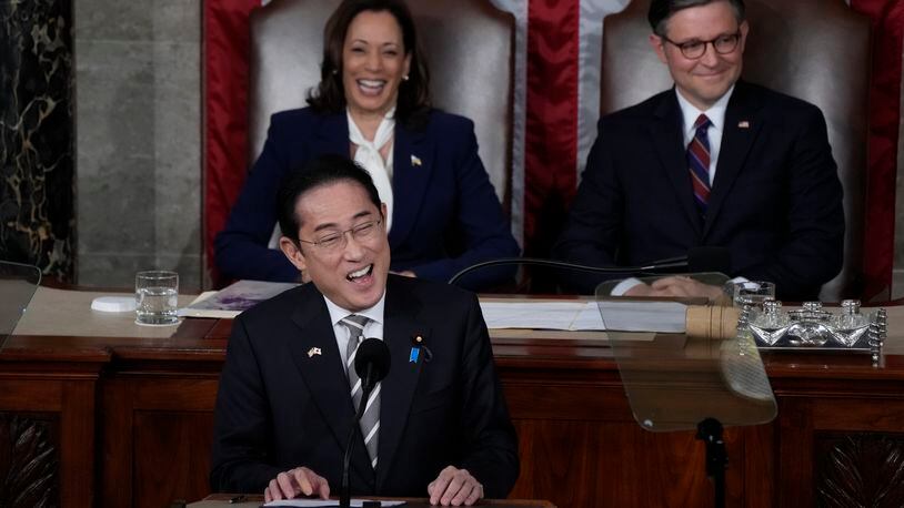 Japan's Prime Minister Fumio Kishida addresses a joint meeting of Congress in the House chamber, Thursday, April 11, 2024, at the Capitol in Washington, as Vice President Kamala Harris and Speaker of the House Mike Johnson, R-La., look on. (AP Photo/Jacquelyn Martin)