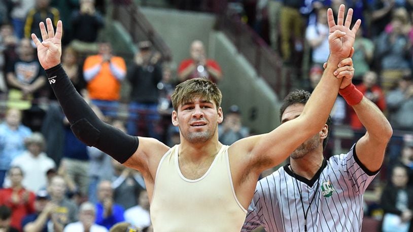 Mechanicsburg senior Kaleb Romero waves to the crowd after capturing his fourth consecutive state championship on Saturday at Value City Arena. Contributed Photo by Bryant Billing