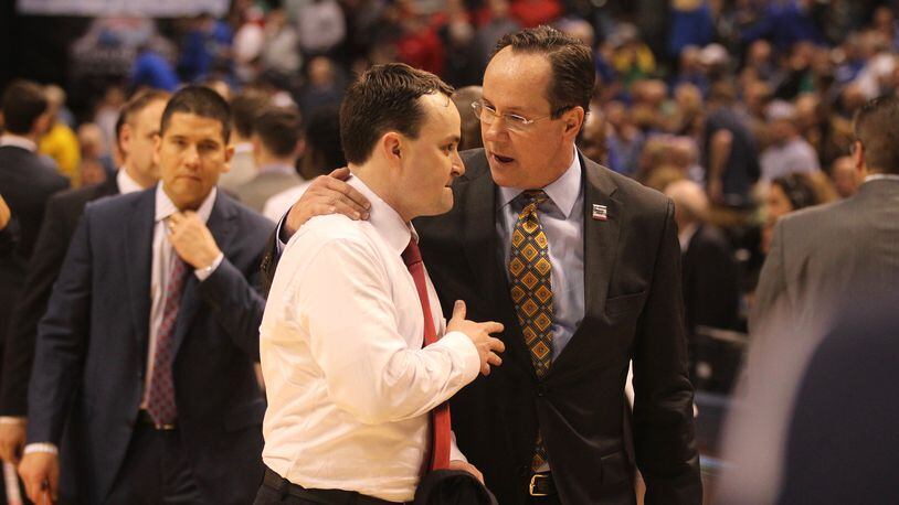 Dayton’s Archie Miller and Wichita State’s Gregg Marshall talk after a NCAA tournament game on Friday, March 17, 2017, at Bankers Life Fieldhouse in Indianpolis. David Jablonski/Staff