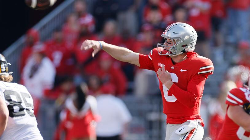 Ohio State quarterback Kyle McCord throws a pass against Iowa during the second half of an NCAA college football game Saturday, Oct. 22, 2022, in Columbus, Ohio. (AP Photo/Jay LaPrete)