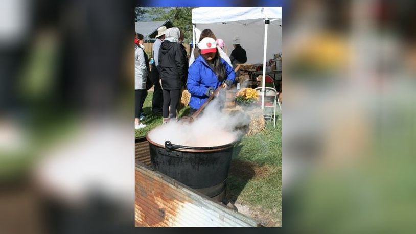 Visitors at the annual Apple Butter Festival will be able to see the process of making the apple butter which includes stirring the kettle to keep it from burning on the bottom. CONTRIBUTED