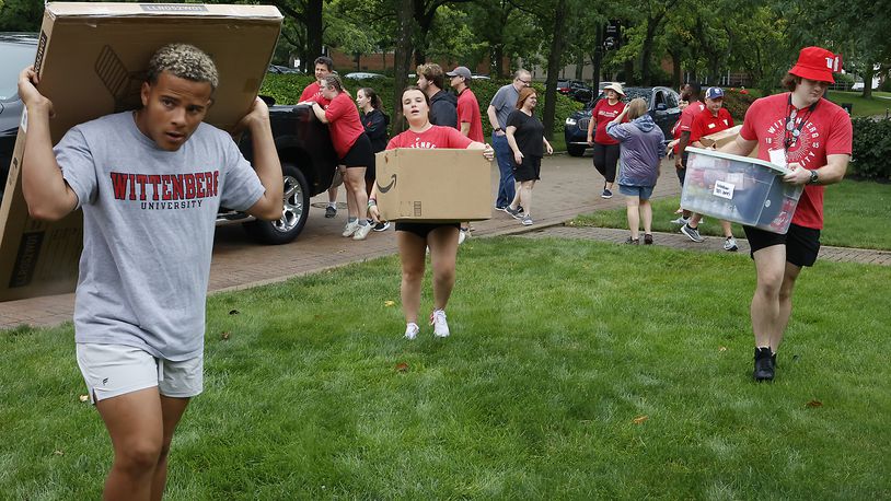Wittenberg students and staff help incoming freshmen move there stuff into the dorms Thursday, August 24, 2023 during "Move-In Day" on campus. BILL LACKEY/STAFF