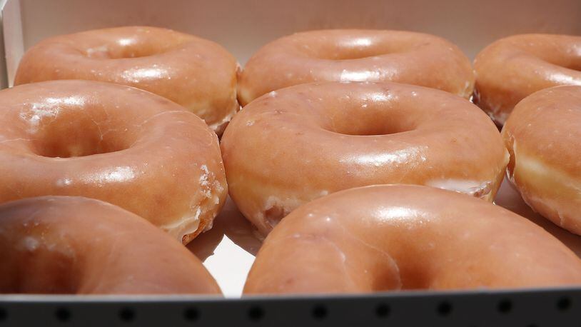 Krispy Kreme doughnuts are now being delivered to customers is some cities via UberEats. (Photo illustration by Joe Raedle/Getty Images)