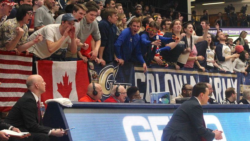 George Washington fans yell at Dayton coach Archie Miller on Saturday, March 4, 2017, at the Smith Center in Washington, D.C.