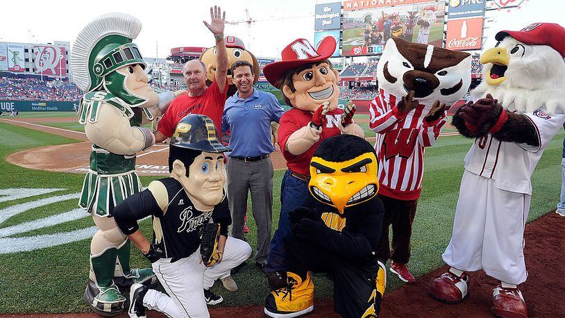 WASHINGTON, DC - JUNE 30: Big Ten Commissioner Jim Delany and Big Ten Network president Mark Silverman pose with the Big Ten mascots and Natioanls mascot Screech before the game between the Washington Nationals and the Colorado Rockies at Nationals Park on June 30, 2014 in Washington, DC.  (Photo by Greg Fiume/Getty Images)