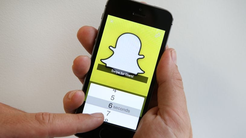 LONDON, ENGLAND - OCTOBER 06: In this photo illustration the Snapchat app is used on an iPhone on October 6, 2014 in London, England. Snapchat allows users' messages to vanish after seconds. (Photo by Peter Macdiarmid/Getty Images)